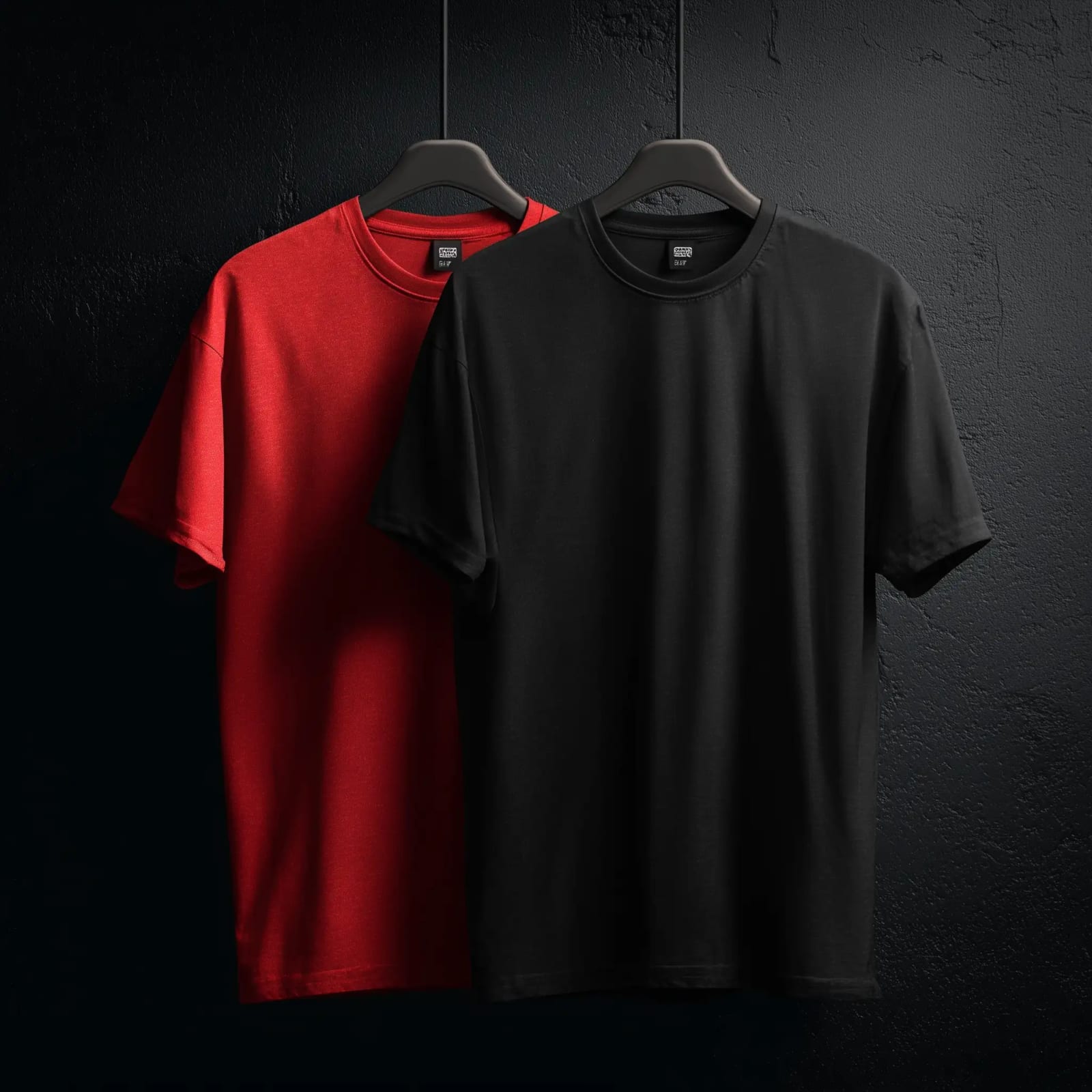 Red and black FA Ink tees on hangers